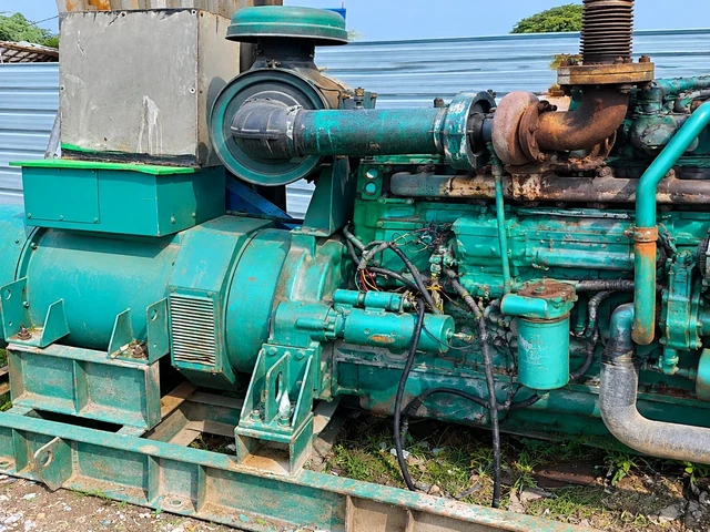 Expert mechanical engineer performing diagnostics and repair overhaul on diesel generator